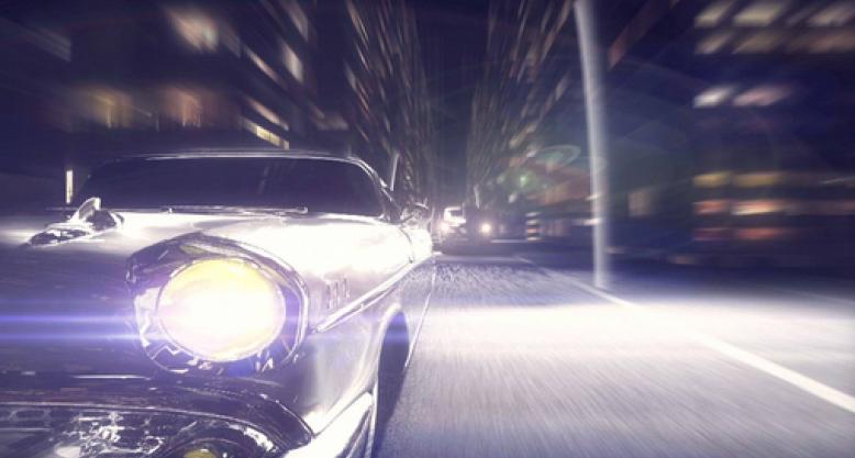 A visual-effects frame shows a vintage car racing through city streets with one headlight blazing.